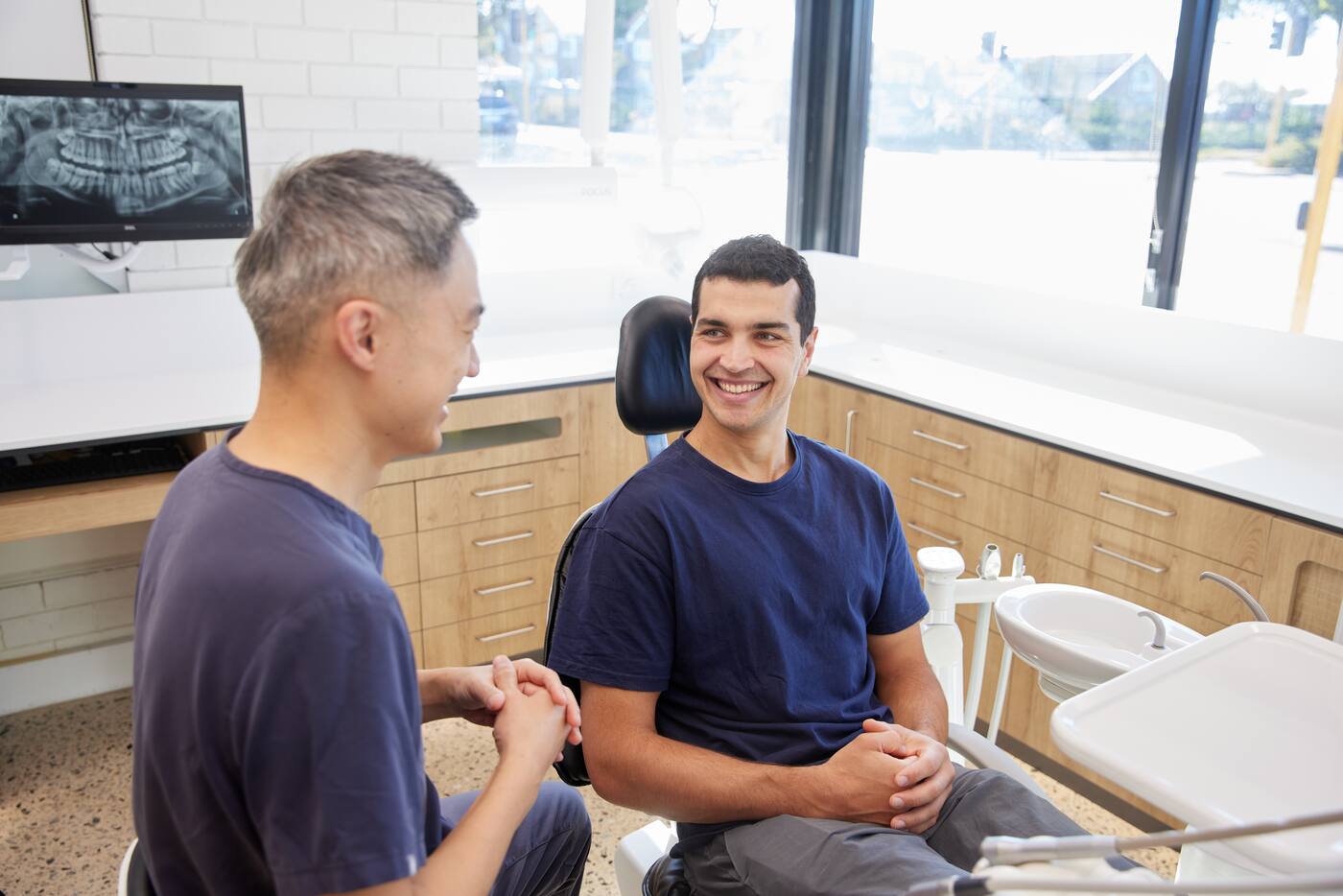 Consultation — dentist speaking with patient